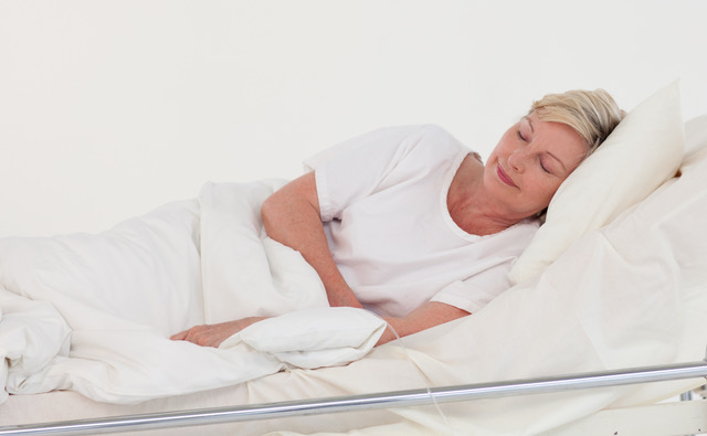 elderly patient lying in bed