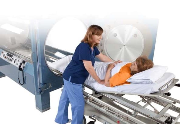 patient and nurse with hyperbaric chamber