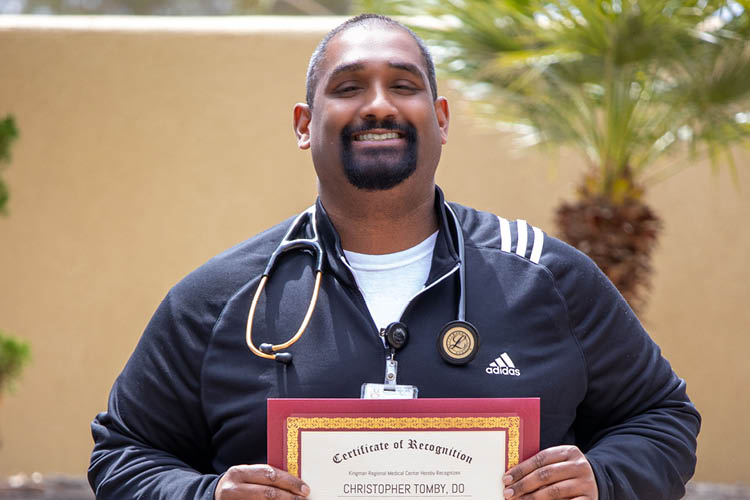 Dr. Christopher Tomby.