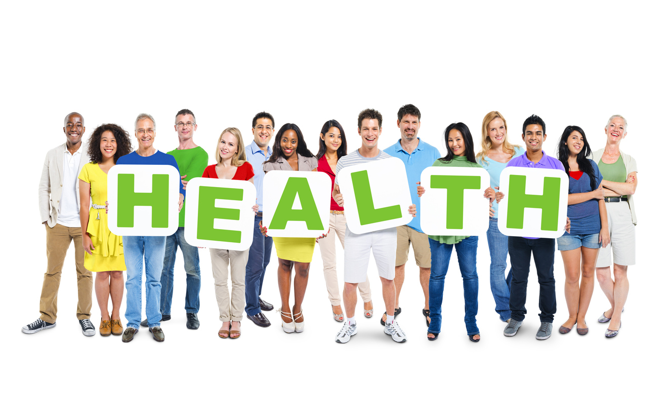 People stand in line holding signs with letters that read "HEALTH"