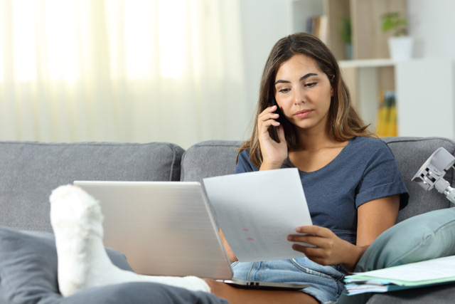 woman looking at paperwork