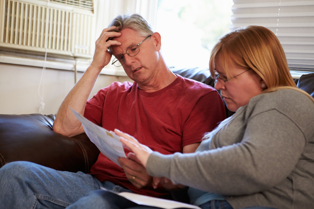 couple reading a paper