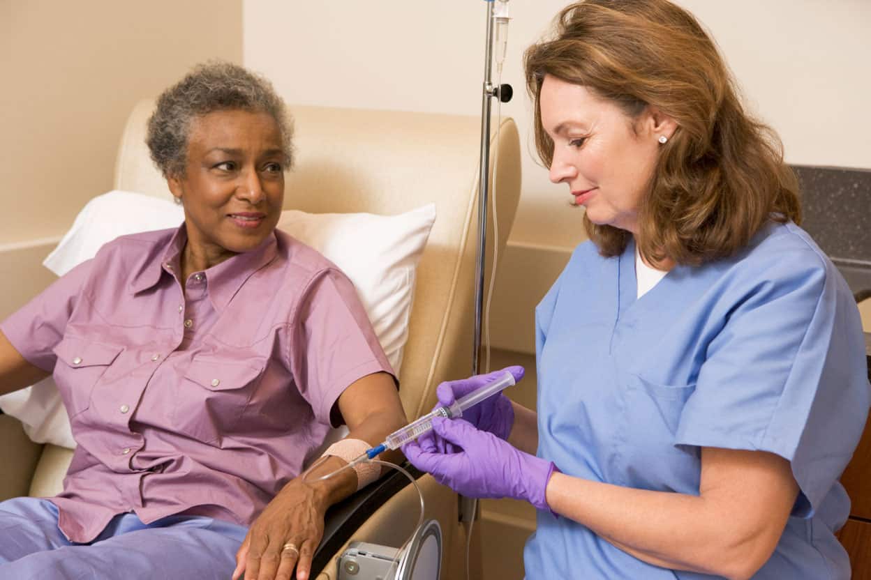 nurse with patient receiving infusion