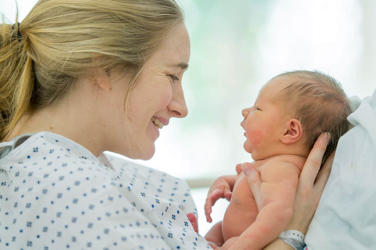 mother holding newborn