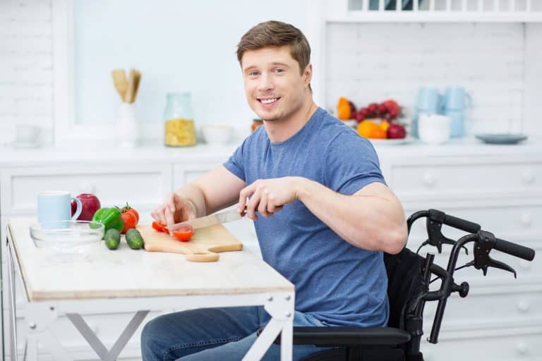 man cutting vegetables