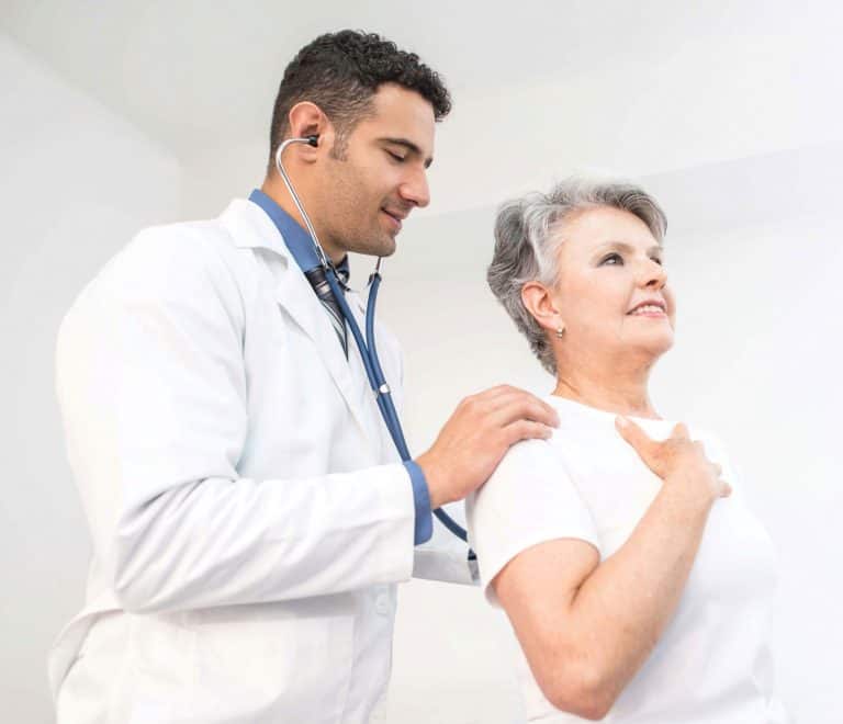 doctor checking patients lungs