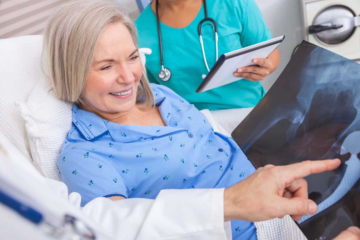 doctor showing woman x-ray