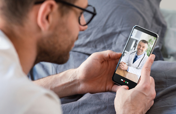 Sameday sick guy looking at phone